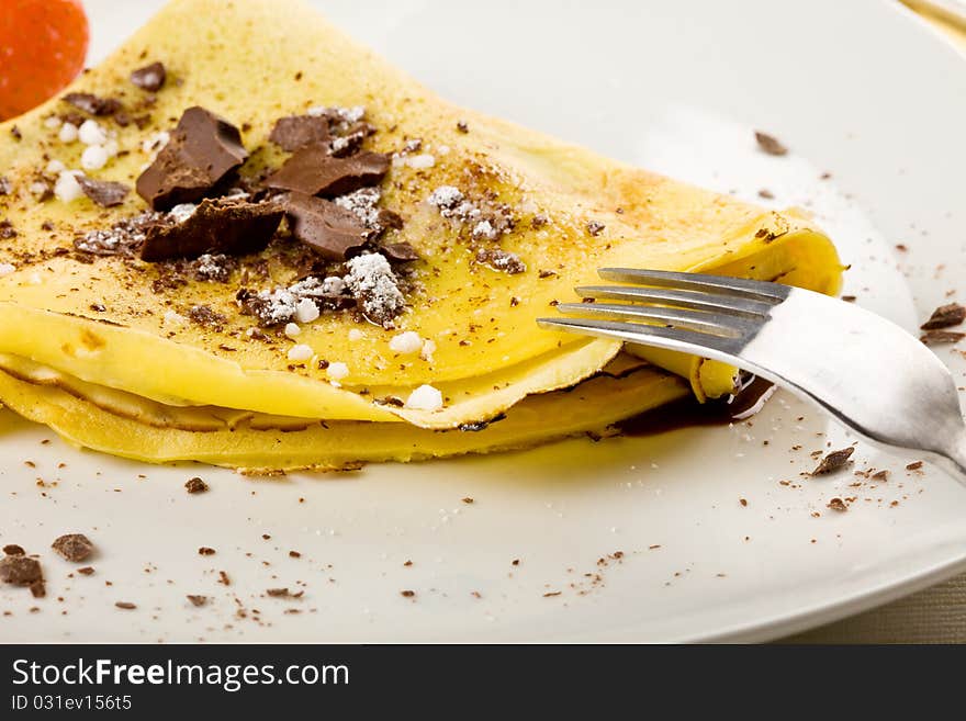 Crepes with choccolate and strawberries