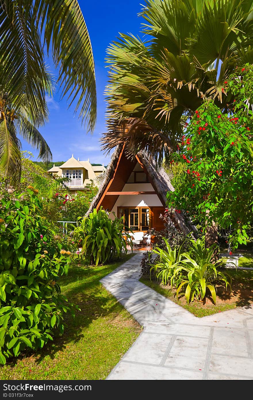 Bungalow in hotel at tropical beach - vacation background