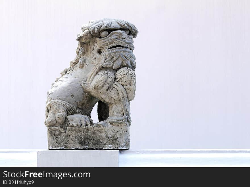 Sculpture of a lion and white wall. Sculpture of a lion and white wall.