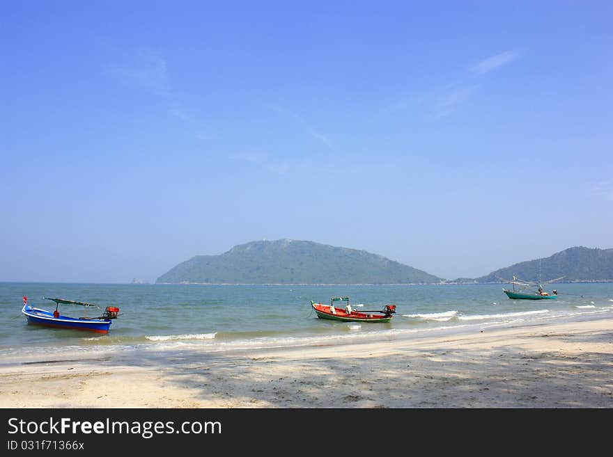 Boat parked along the beach shore. Boat parked along the beach shore