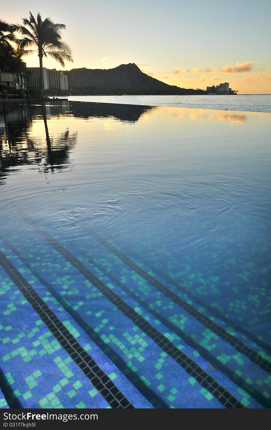 Diamond Head Is Reflected In An Infinity Pool