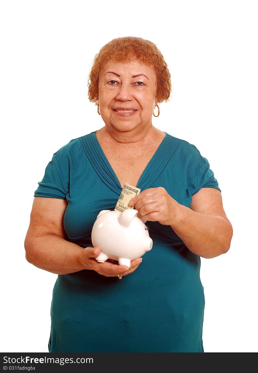 Hispanic female senior with piggy bank. Hispanic female senior with piggy bank