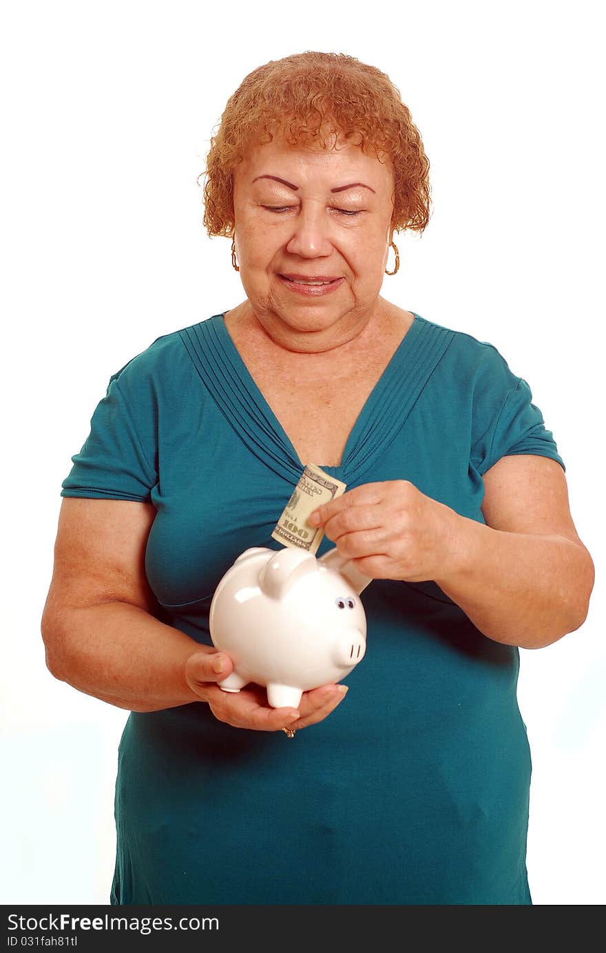 Hispanic female senior with piggy bank. Hispanic female senior with piggy bank