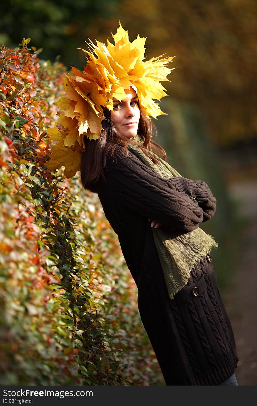 Woman in autumn wreath on a head. Woman in autumn wreath on a head