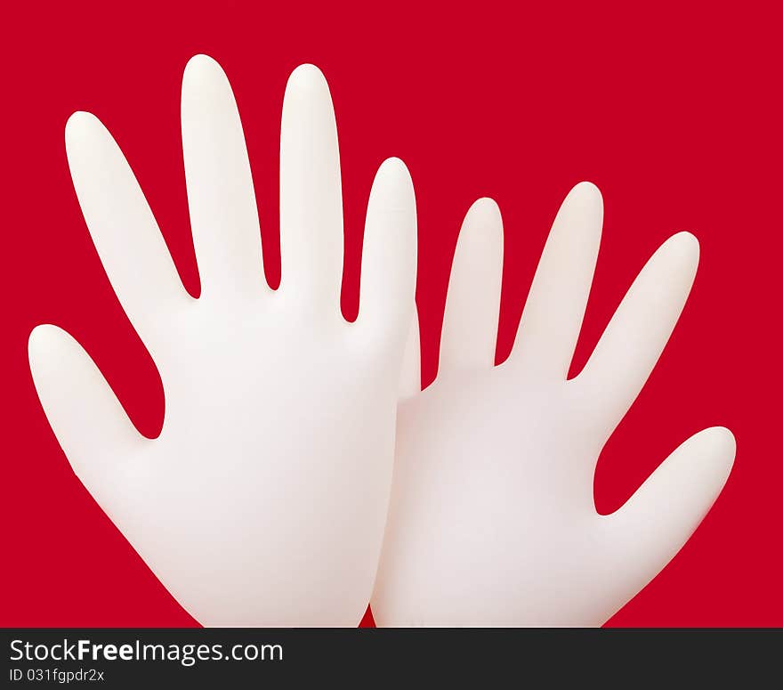 Medical gloves on red background