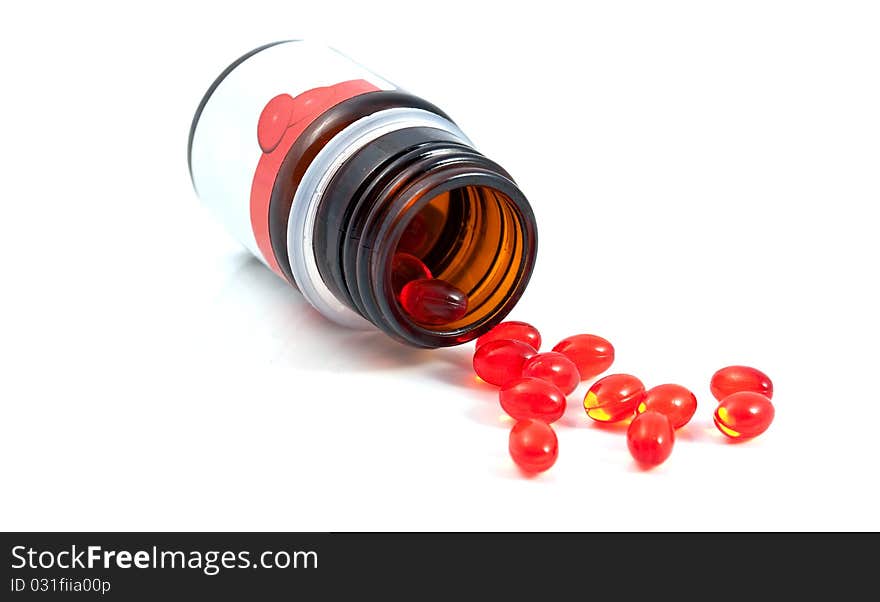 A bottle of vitamins on a white background