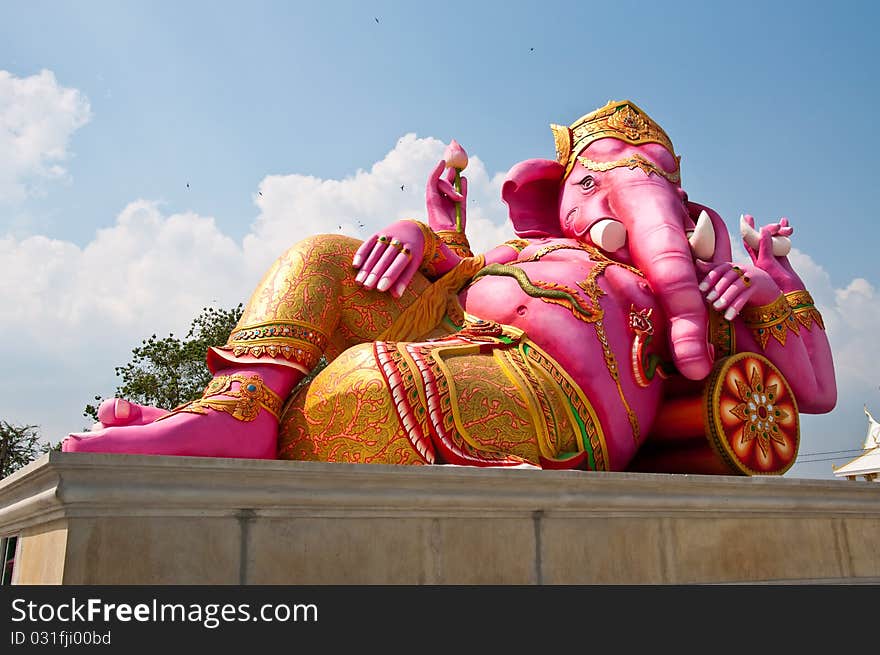 Pink ganesha statue in relaxing action, Thailand.