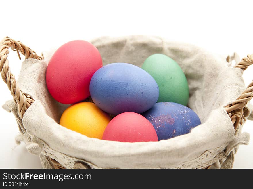 Colored eggs in the basket