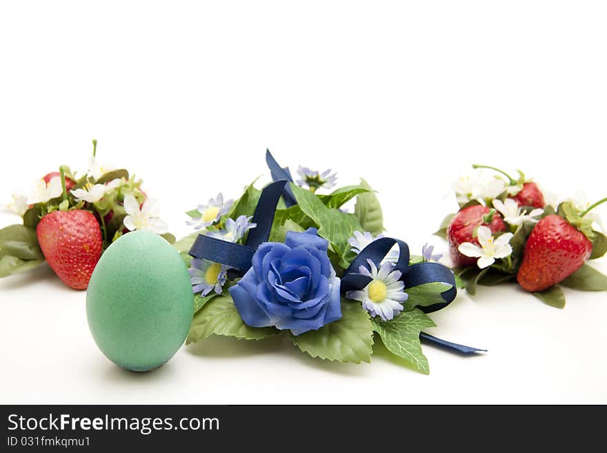 Easter-egg with strawberries and flower jewelry. Easter-egg with strawberries and flower jewelry