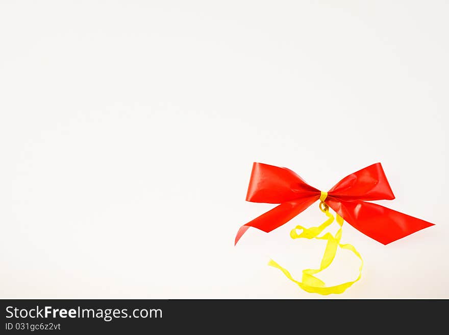 Christmas bow in right corner on white background