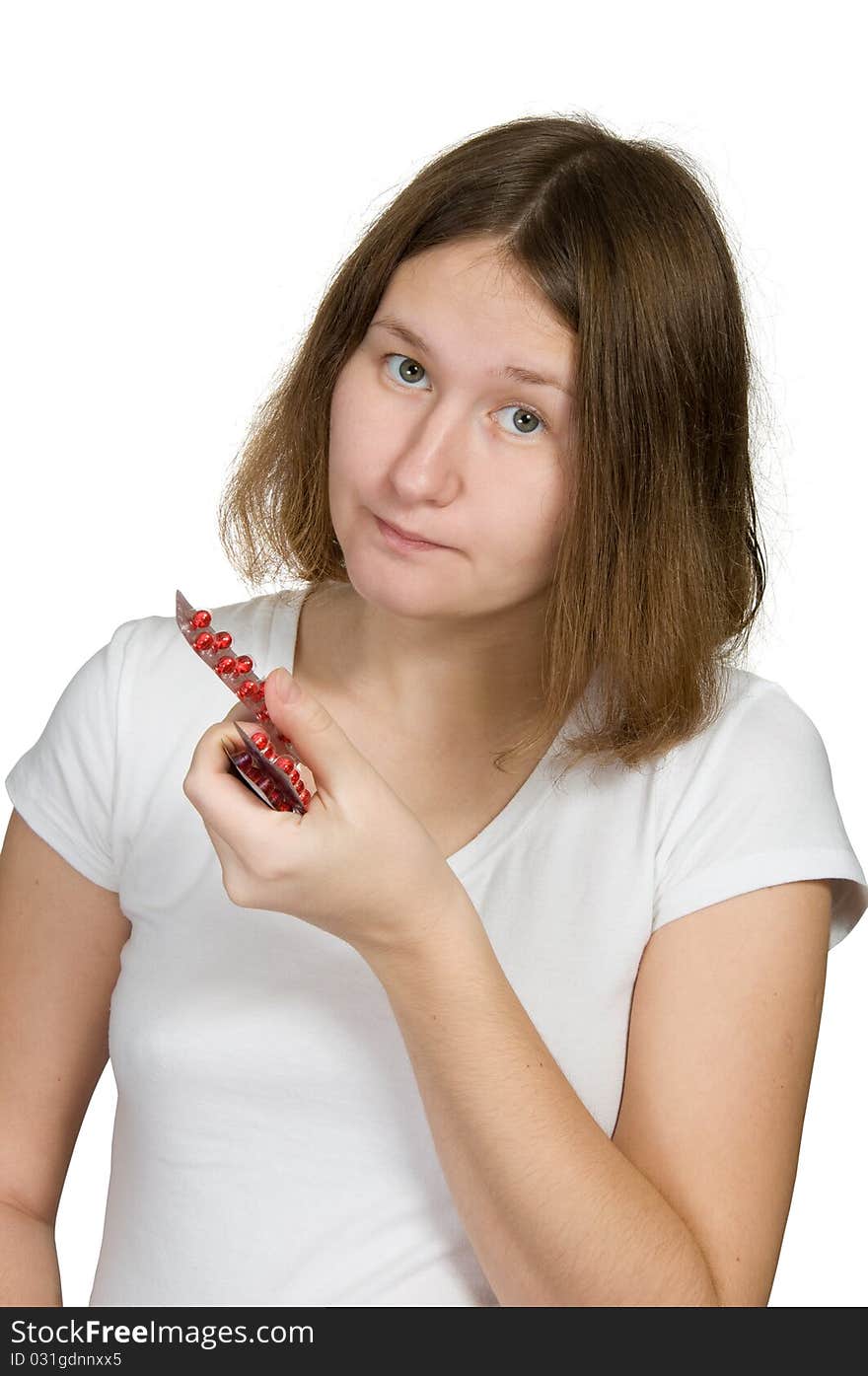 Attractive woman with pills over white. Attractive woman with pills over white