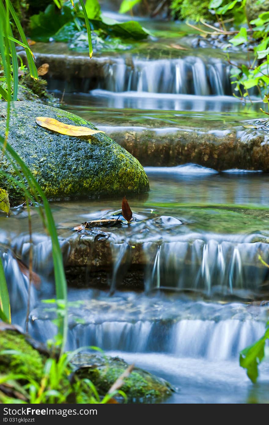 Beautiful veil cascading waterfalls, mossy rocks