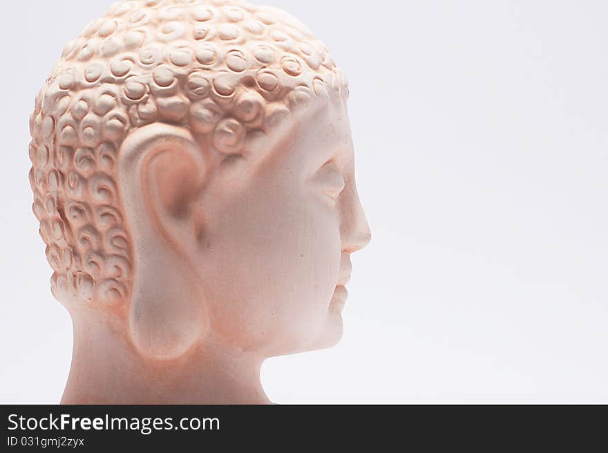 Head of a buddha on white ground