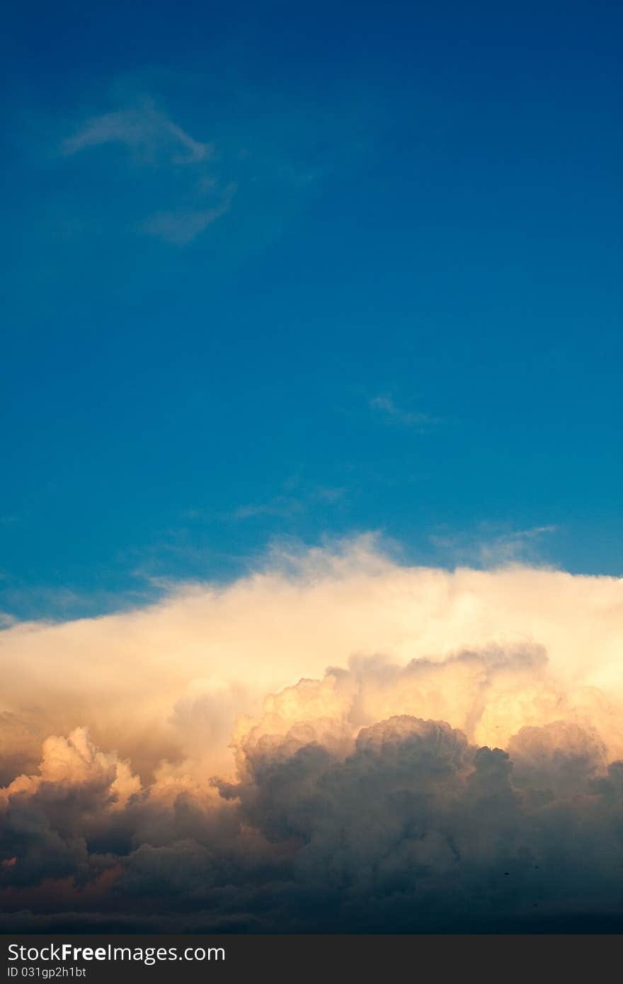 Beautiful clouds at sunset. Vertical.