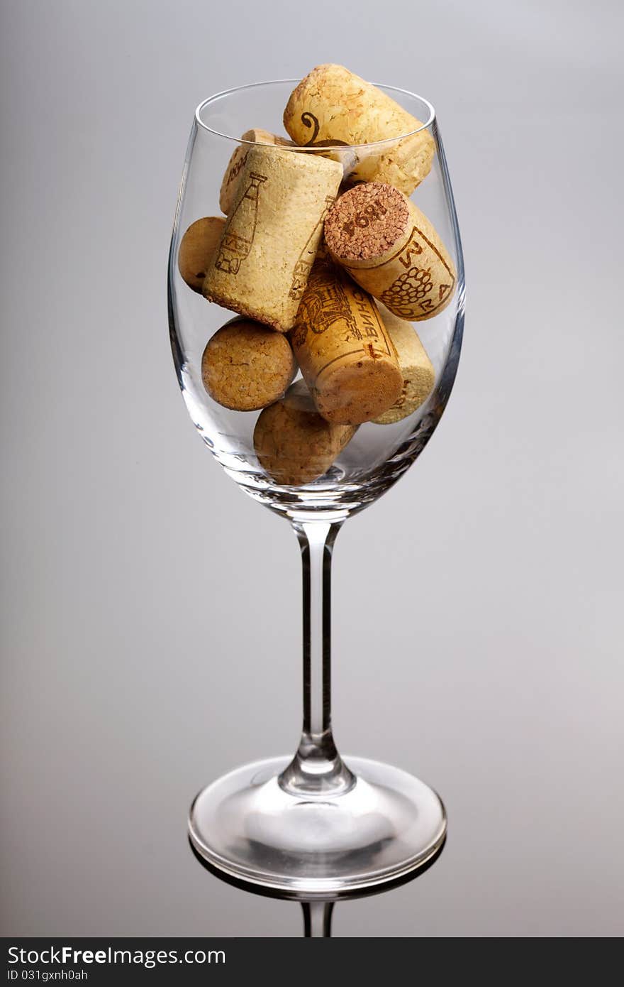 Wineglass full of corks