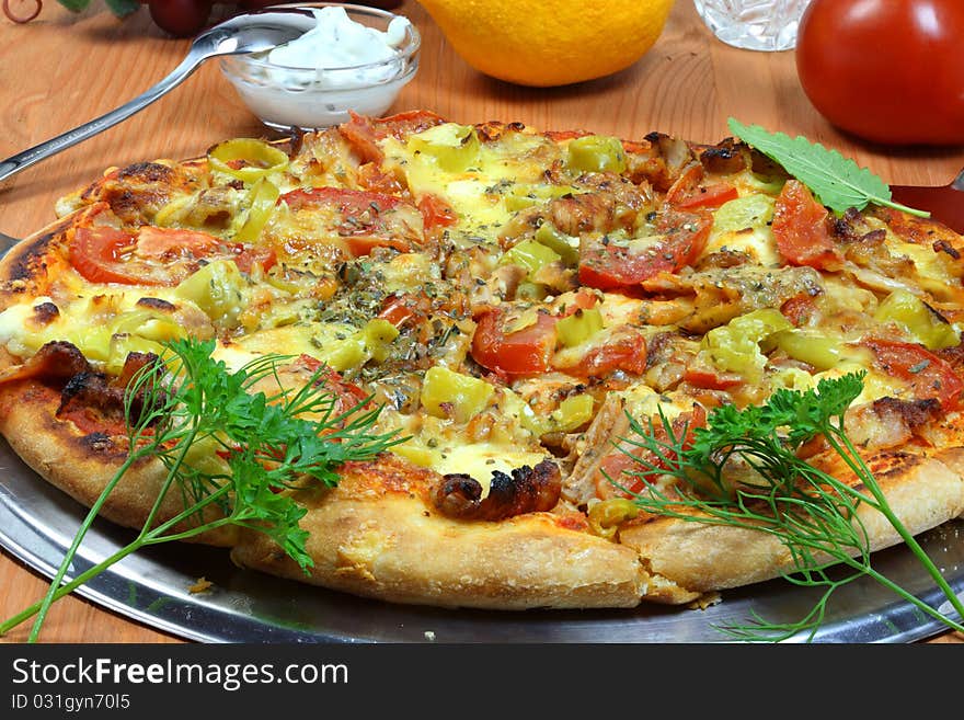 Pizza and vegetables on the table. Pizza and vegetables on the table.