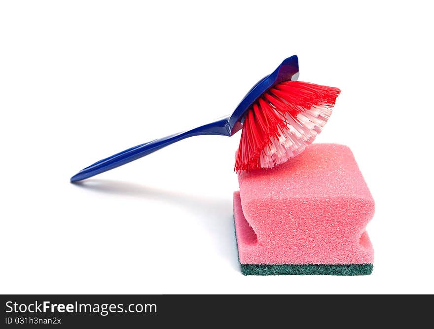 Cleaning brush and kitchen sponge isolated on a white background. Cleaning brush and kitchen sponge isolated on a white background.