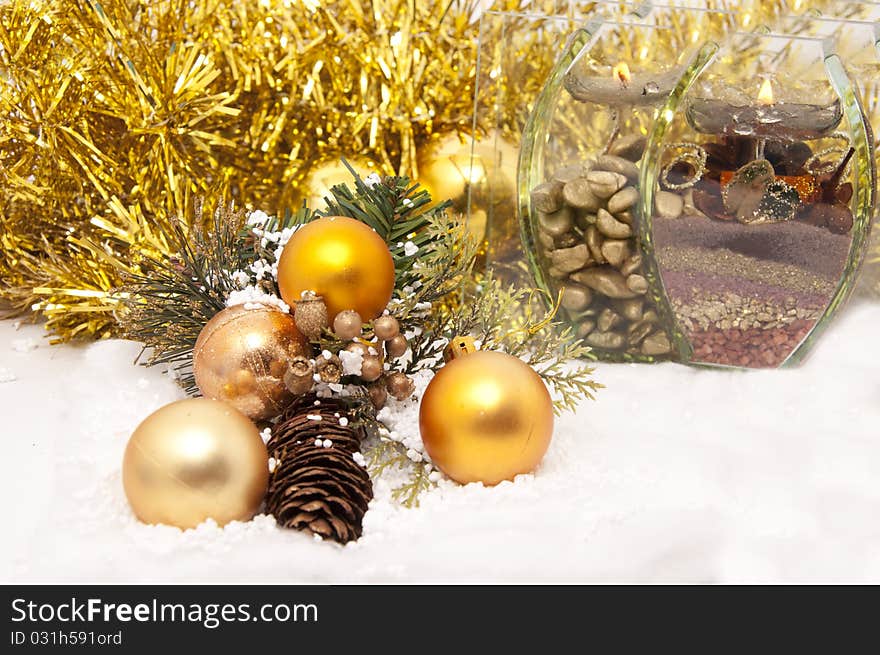 Christmas decoration of golden color in the snow