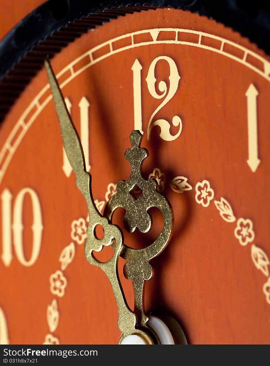 Closeup view of antique clock face. Last minutes before midnight.