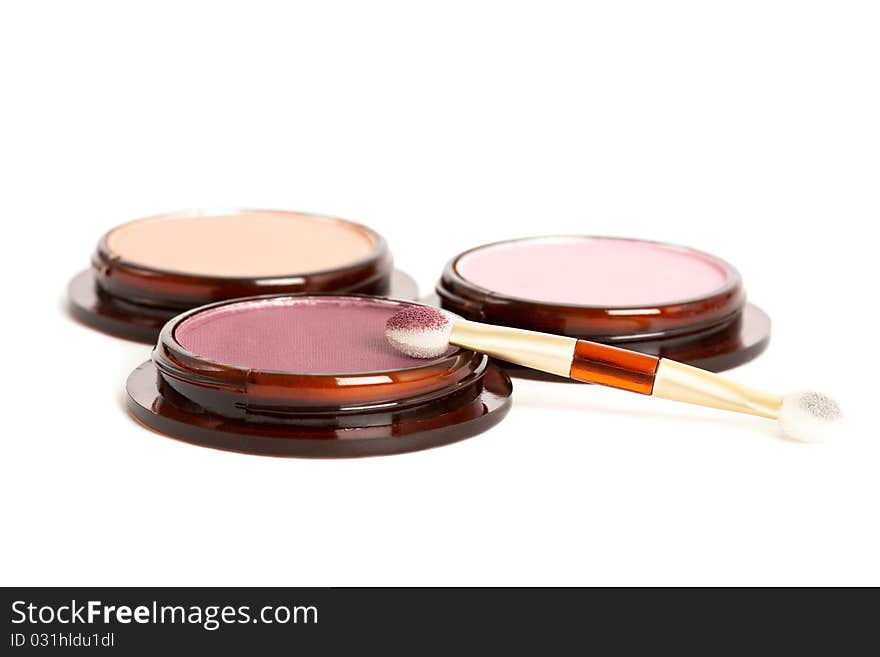 Make-up eyeshadows and cosmetic brush