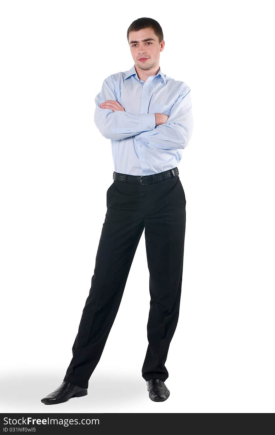 A young man in a blue shirt and black trousers, in isolation. A young man in a blue shirt and black trousers, in isolation.