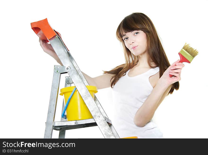 Attractive girl with paintbrush over white