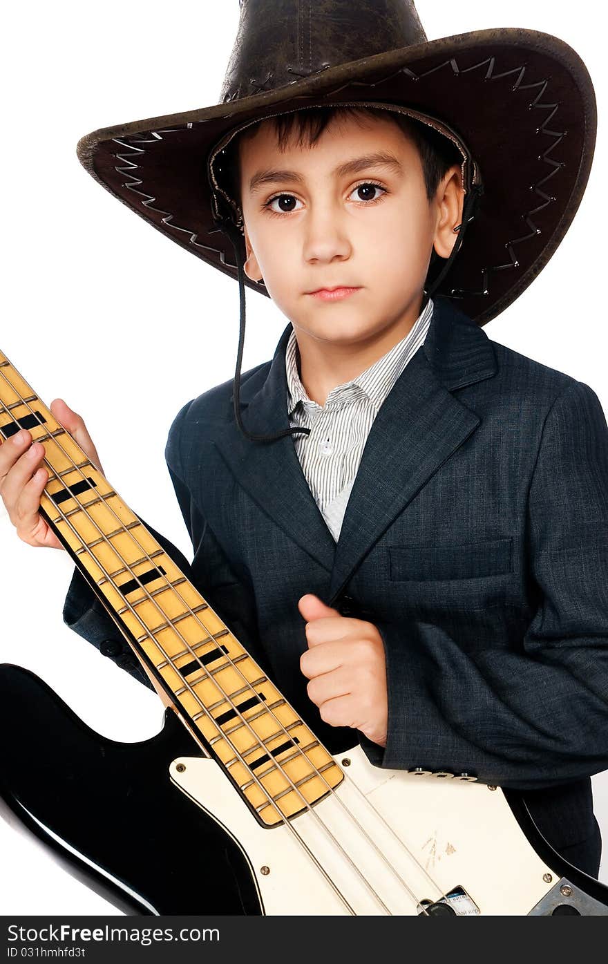 Boy in a cowboy hat and guitar isolated on white background