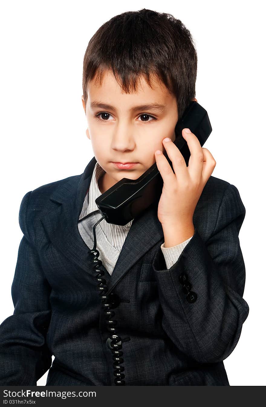 Young boy talking on the phone isolated on white background