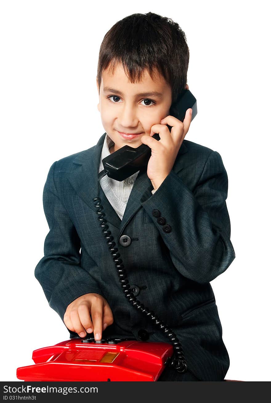 Young boy talking on the phone isolated on white background