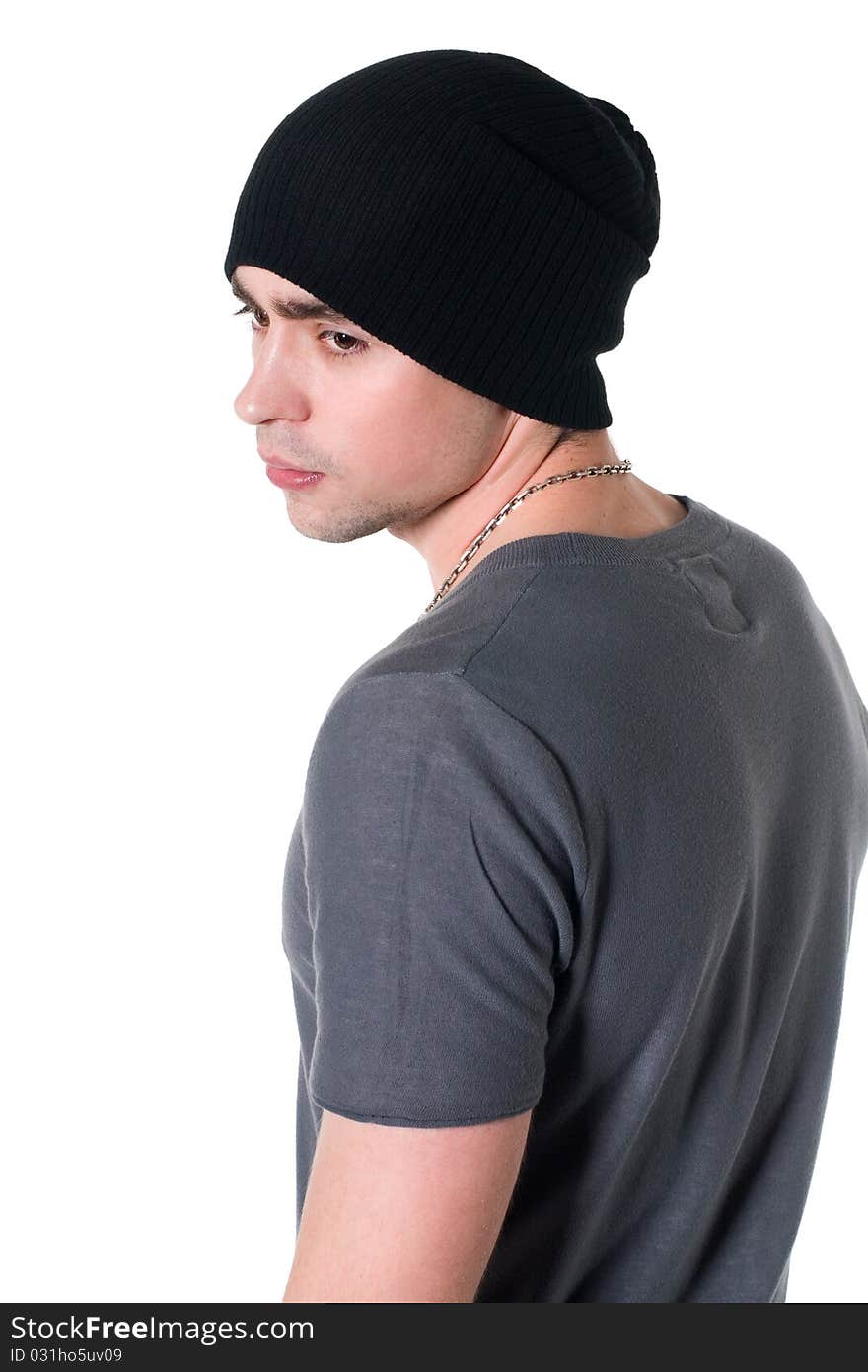 Beautiful young man in a black cap