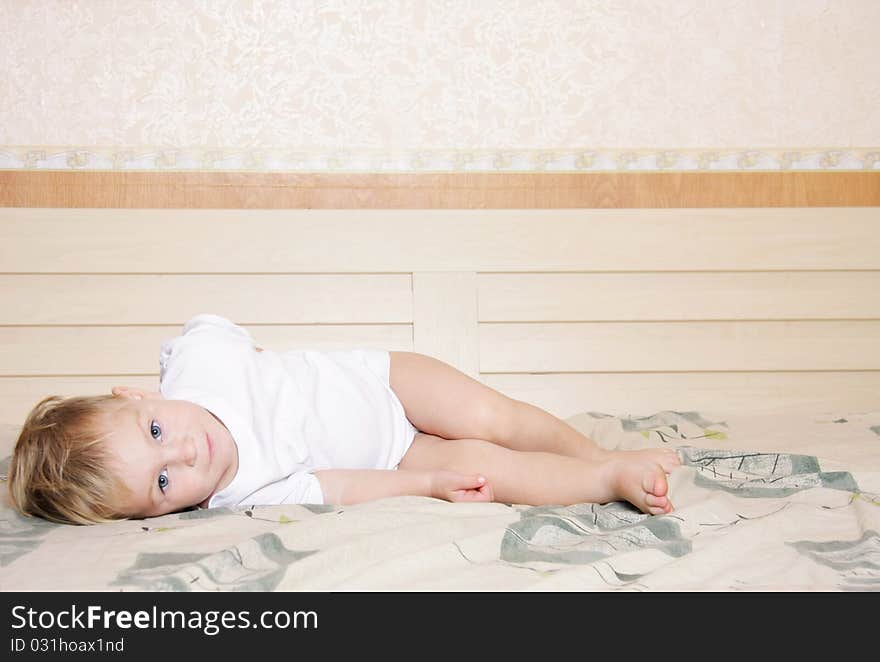 Cute child playing on bed. Cute child playing on bed