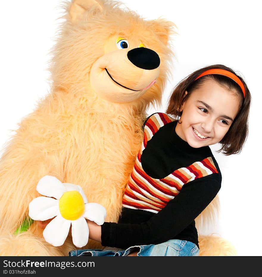 Beautiful girl with a bright orange bear. Beautiful girl with a bright orange bear