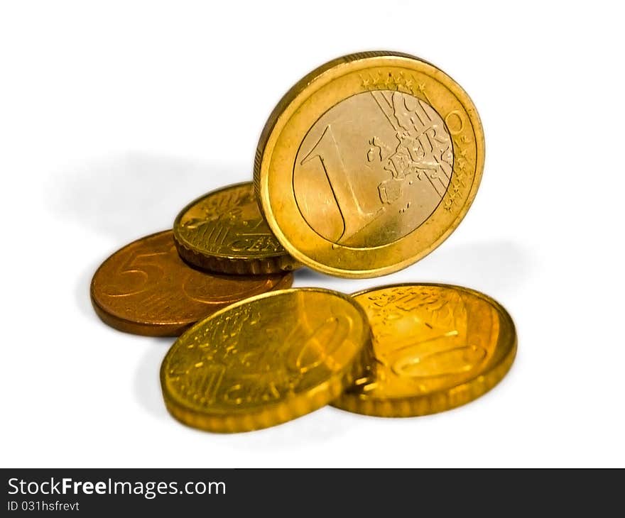 Euro coins, one stands on the edge. Euro coins, one stands on the edge