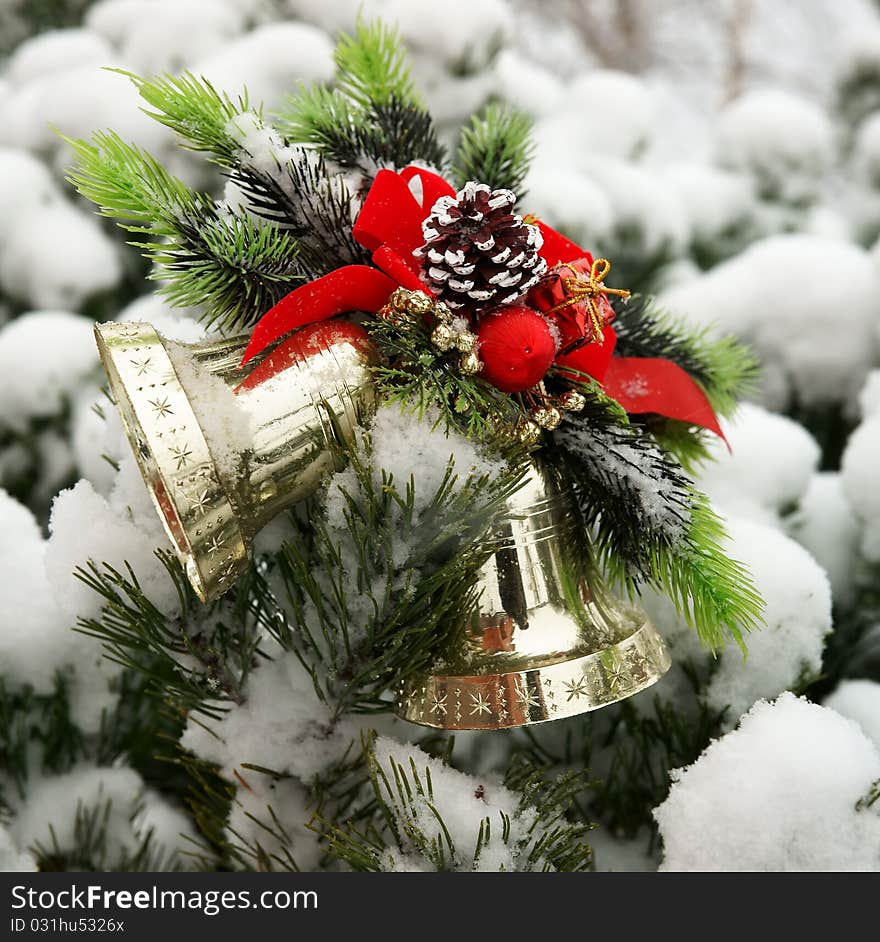 Christmas hand bells on a fur-tree