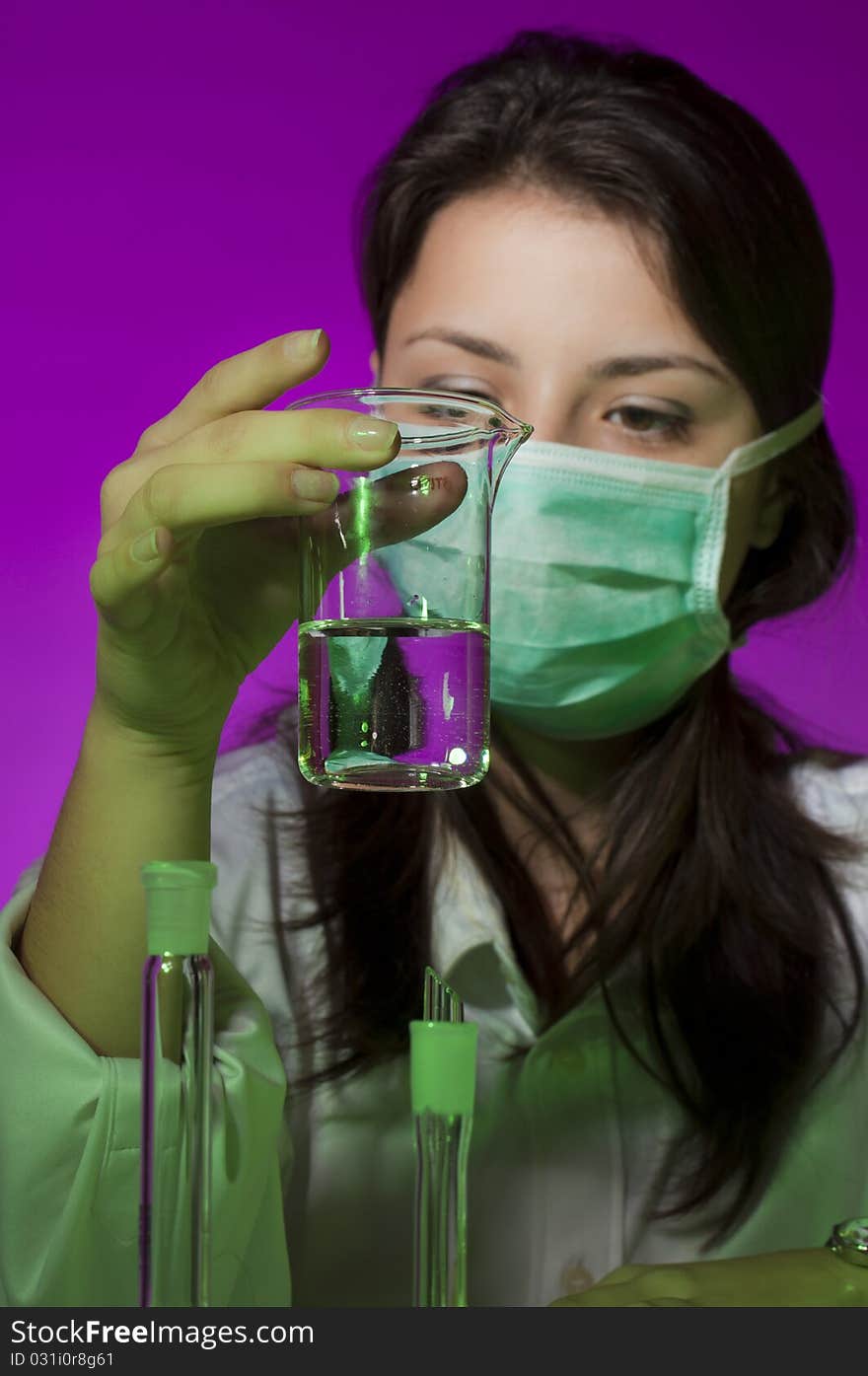 Young scientist in laboratory examining sample