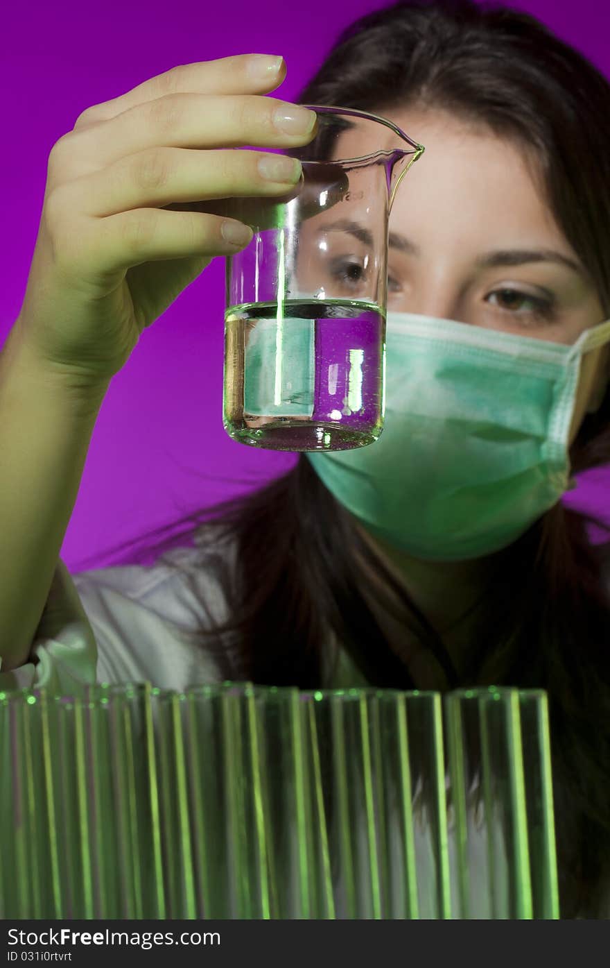 Young scientist in laboratory examining sample