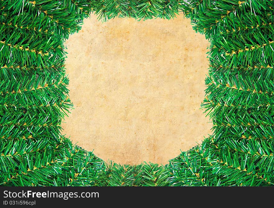 Christmas green framework with Pine needles isolated on paper textures background