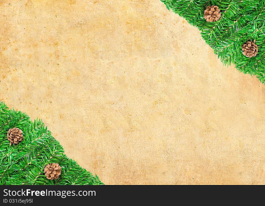 Christmas green framework with Pine needles and cones  isolated on paper textures background. Christmas green framework with Pine needles and cones  isolated on paper textures background