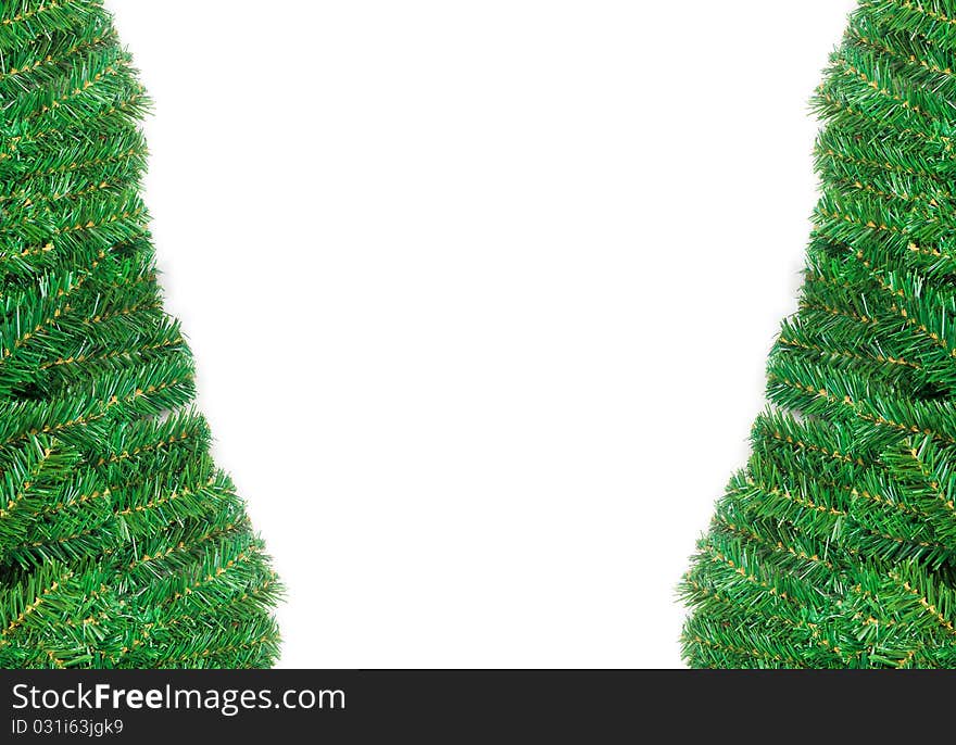 Christmas Tree Branches Bordering a White Background. Christmas Tree Branches Bordering a White Background