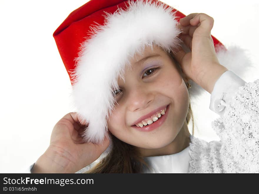 Cute cheerful little girl in a cap of Santy. Cute cheerful little girl in a cap of Santy