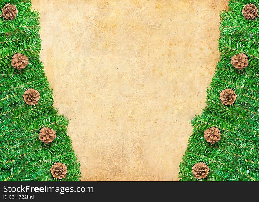 Christmas green framework with Pine needles and cones isolated on paper textures background. Christmas green framework with Pine needles and cones isolated on paper textures background