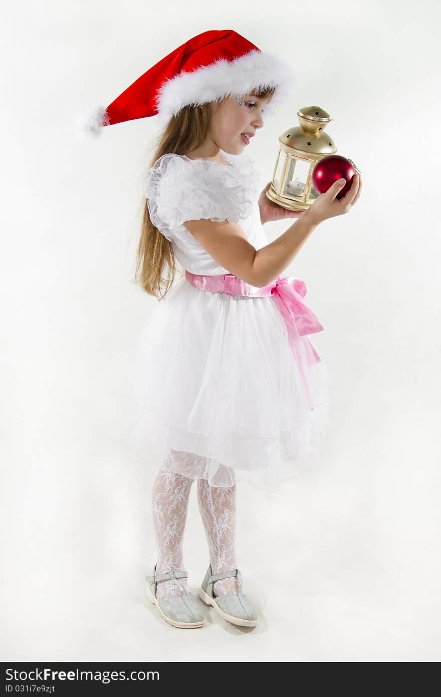 Cute cheerful little girl in a cap of Santy. Cute cheerful little girl in a cap of Santy