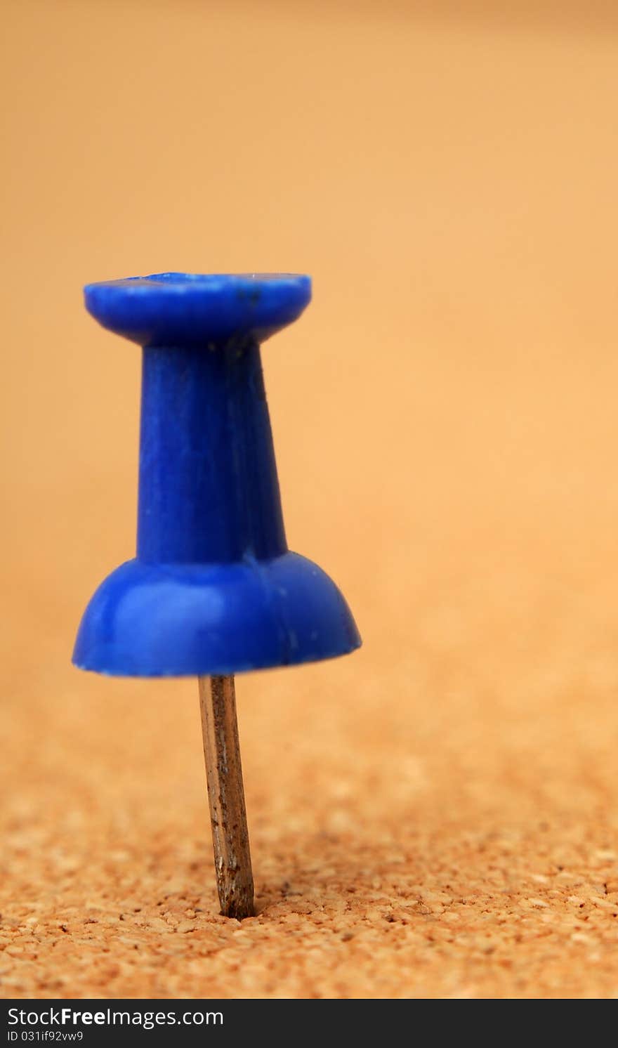 Macro closeup of Tack on corkboard