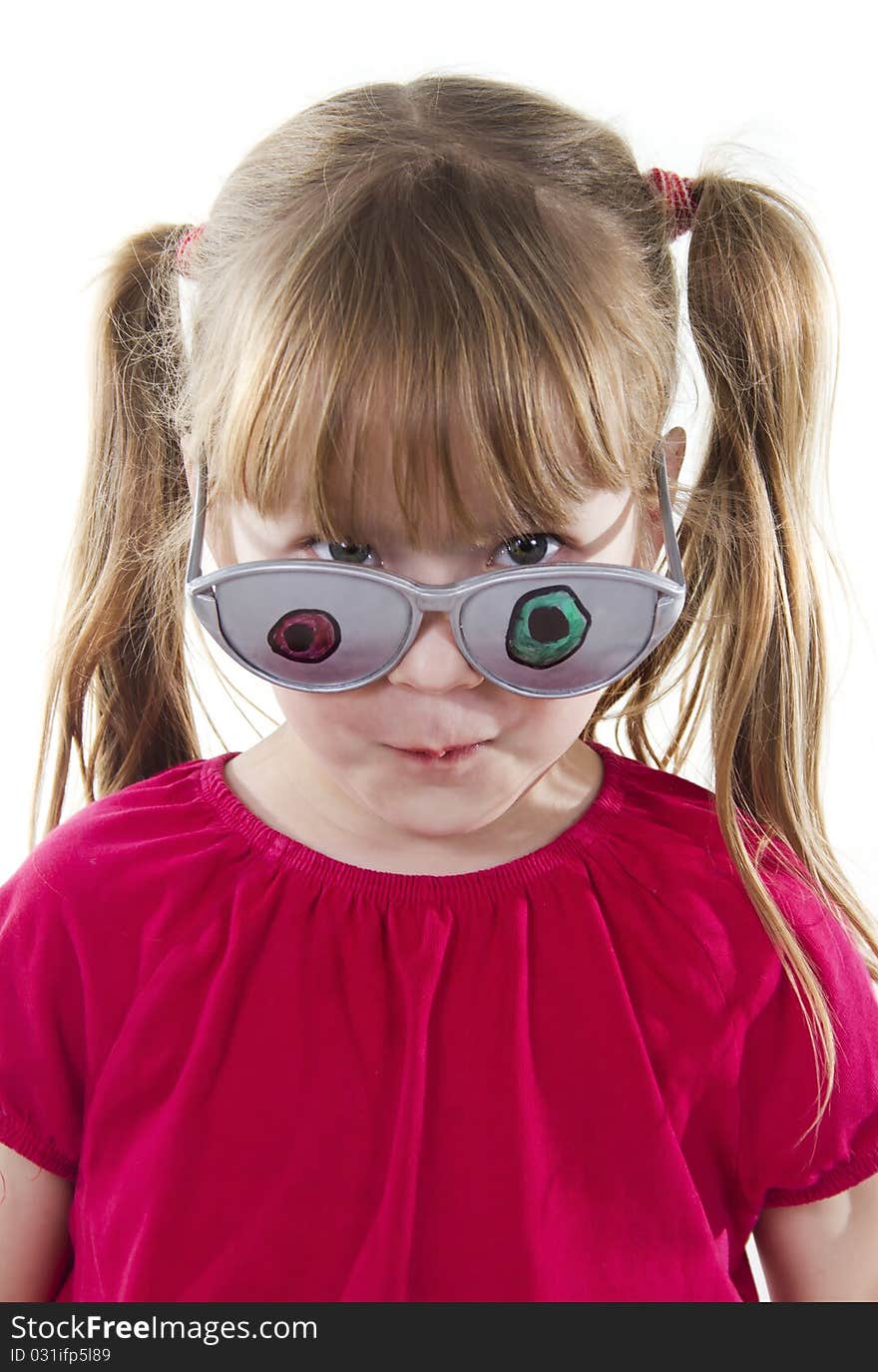 Girl in ridiculous eyeglasses looks in the chamber