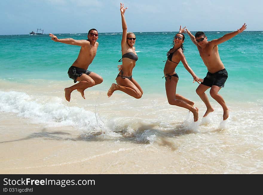 People jumping in the ocean