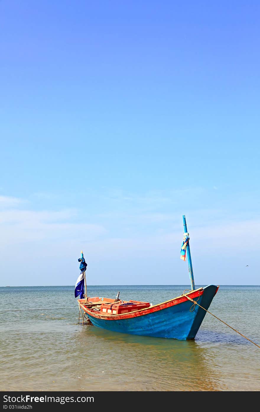 Lonely fisherman long tail boat