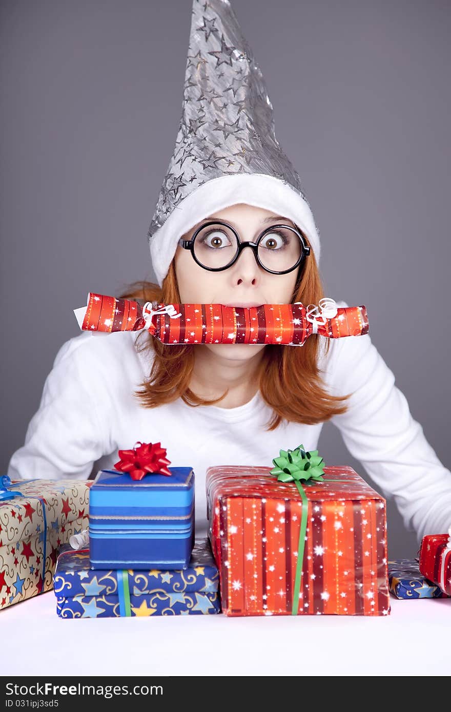 Surprised Red-haired Girl In Christmas Cap