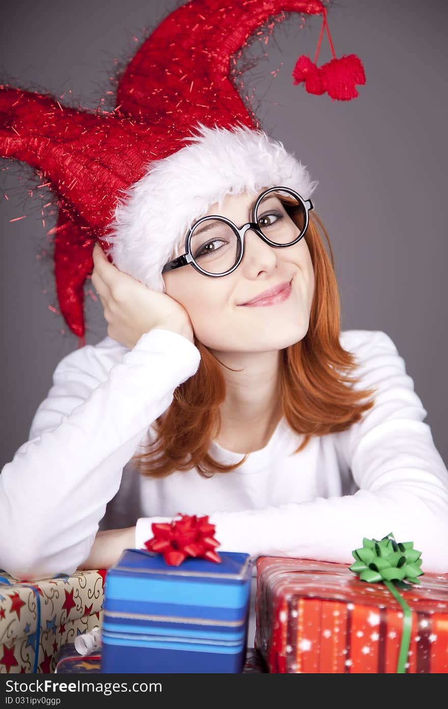 Surprised Red-haired Girl In Christmas Cap