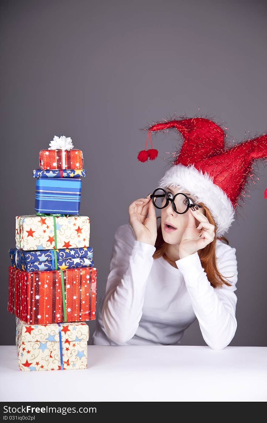 Surprised Red-haired Girl In Christmas Cap