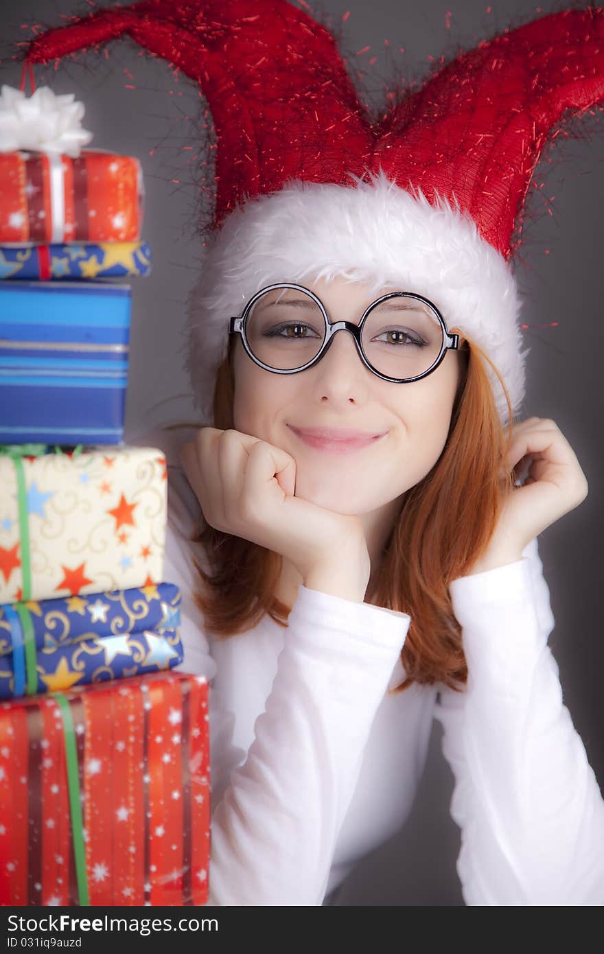 Surprised Red-haired Girl In Christmas Cap